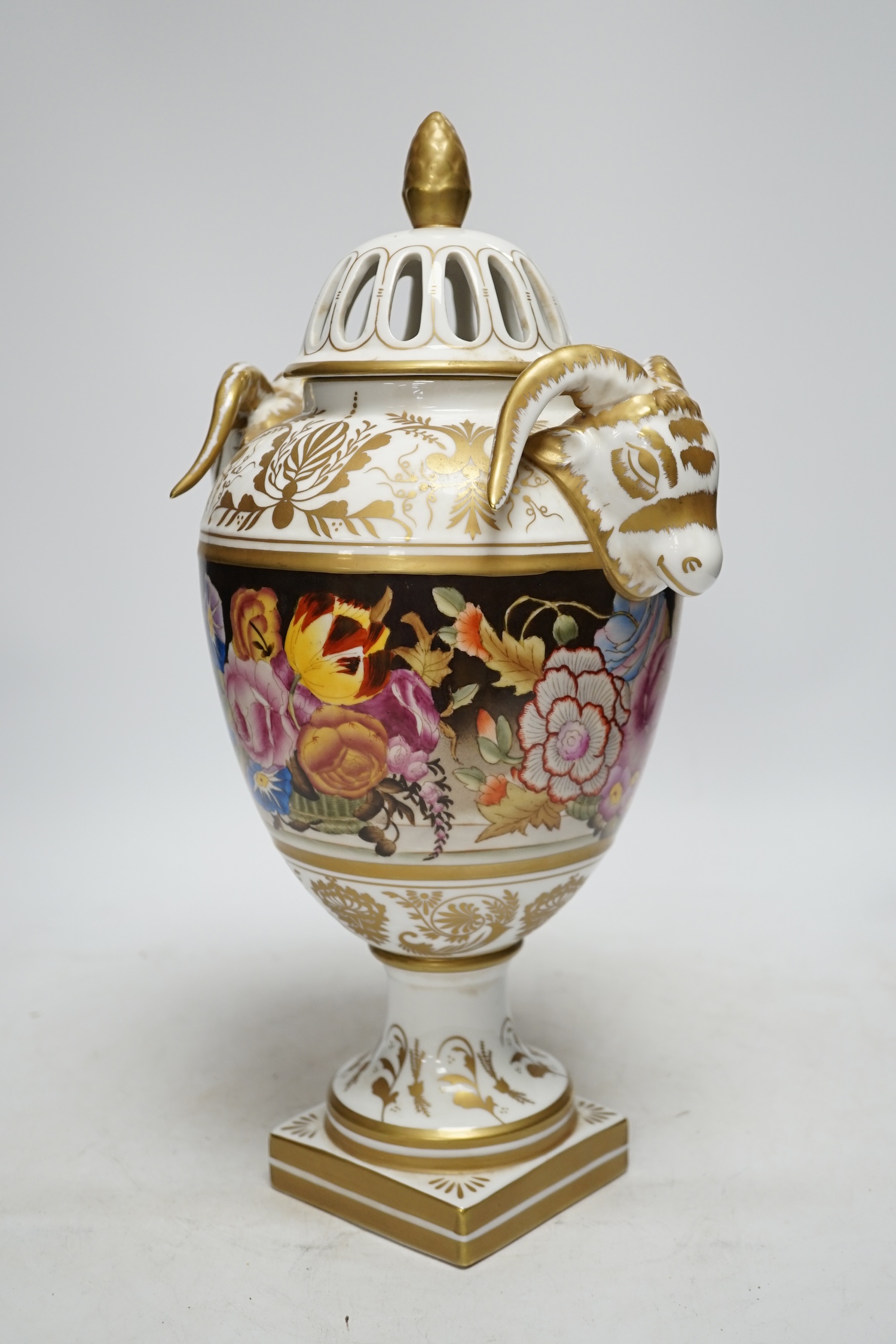 A late 20th century ‘rams head’ porcelain urn and cover, 38cm